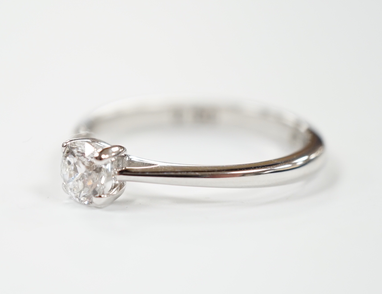 An 18ct white gold and solitaire diamond ring, the stone weighing 0.50ct, size R, gross weight 3.6 grams.